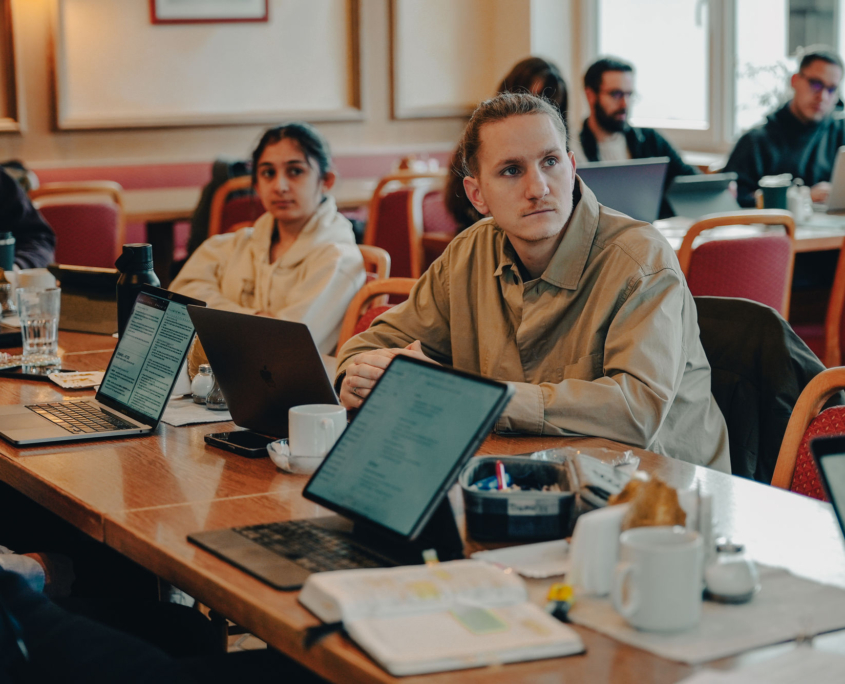 a student is looking at the teacher and paying attention at the European Theological Seminary.