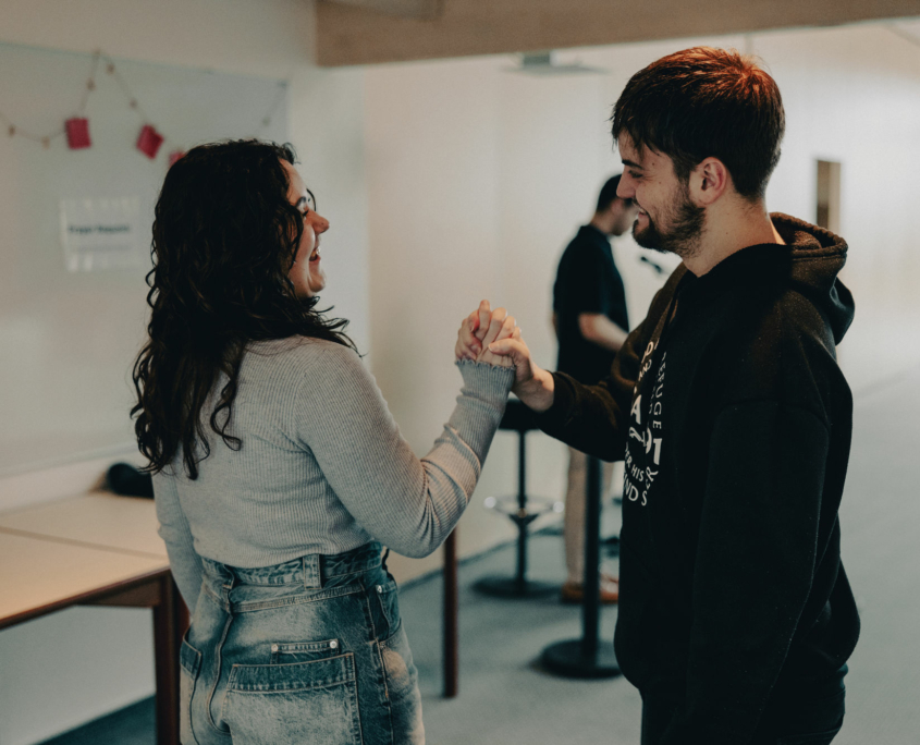 Two students of the European Theological Seminary are greeting each other