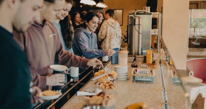 Students of the European Theological Seminary are standing in line for Coffee and Cookies
