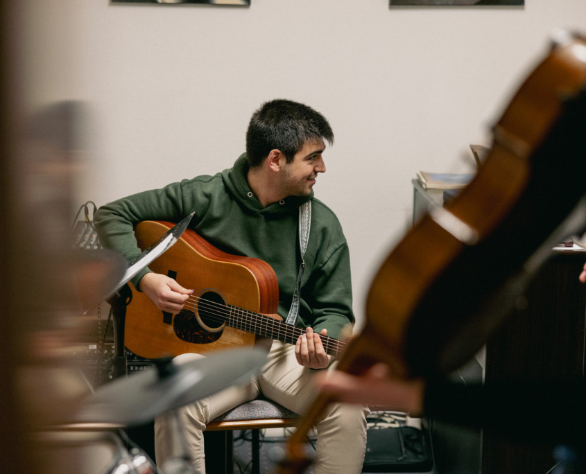 A music major student of the European Theological Seminary is playing guitar